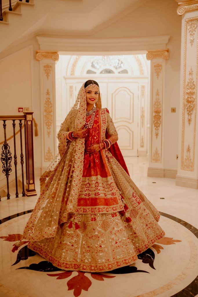 Dazzling Golden Wedding Outfits to Shine on Your Golden Day, A Royal Destination Wedding With The Bride In A Stunning Red White Lehenga