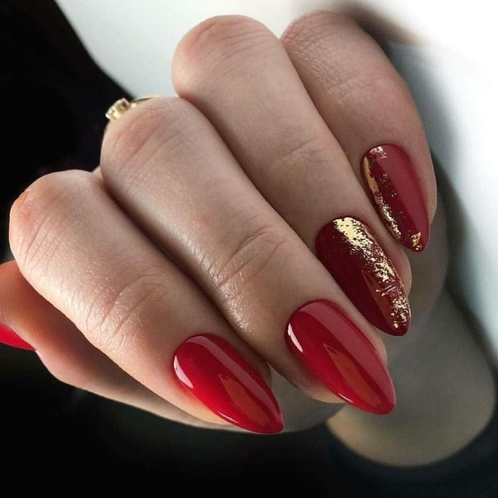 Startling Nail Trends For Brides This Wedding Season, Classic dark red manicure with gold foil Nail art designs